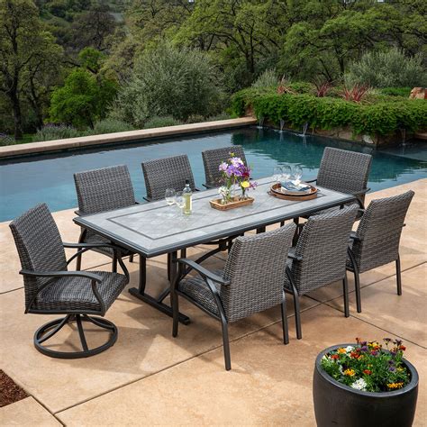 SunVilla Lago Brisa 7-piece Fire Outdoor <b>Dining</b> <b>Set</b> 6 Swivel <b>Dining</b> Chairs, Rectangular Fire <b>Dining</b> TableAll-Weather Hand-woven WickerCushions are Made with Sunbrella® Fabric that is Resistant to Stains, Mildew, Chlorine and Fading. . Costco patio dining sets